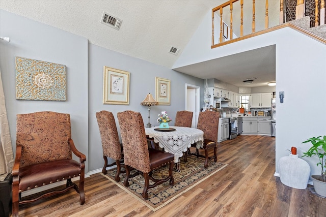 500 W San Diego St, Detroit, TX 75436 - dining area with wood finished floors, lofted ceiling, and baseboards