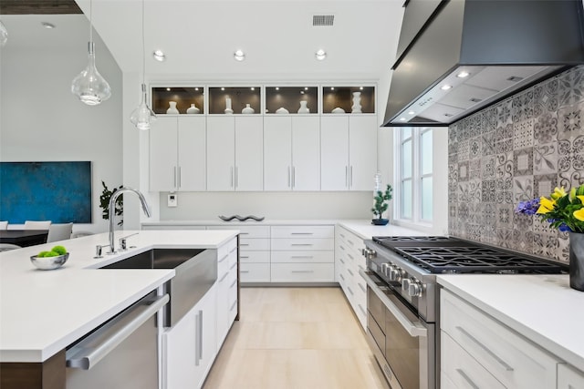 315 Oxford Pl, Coppell, TX 75019 - kitchen featuring extractor fan, appliances with stainless steel finishes, a sink, light countertops, and recessed lighting
