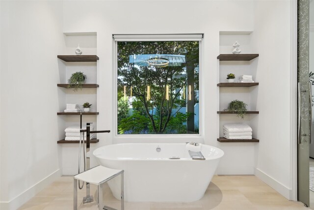 315 Oxford Pl, Coppell, TX 75019 - full bathroom with a freestanding tub and baseboards