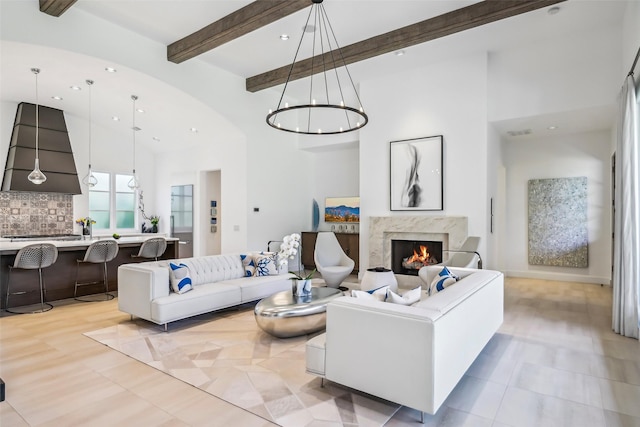 315 Oxford Pl, Coppell, TX 75019 - living room featuring high vaulted ceiling, a chandelier, a high end fireplace, recessed lighting, and beamed ceiling