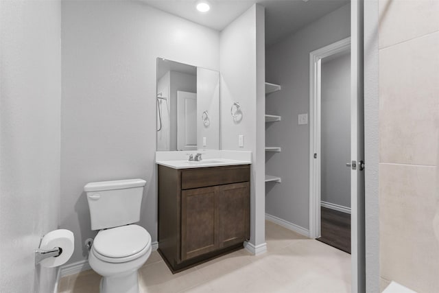 506 Cool Canyon Trl, Princeton, TX 75407 - bathroom with vanity, toilet, tile patterned flooring, and baseboards