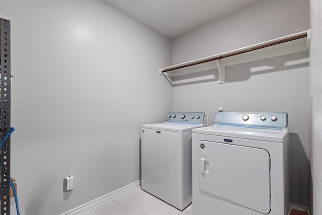 506 Cool Canyon Trl, Princeton, TX 75407 - washroom featuring washing machine and dryer, light tile patterned flooring, and baseboards