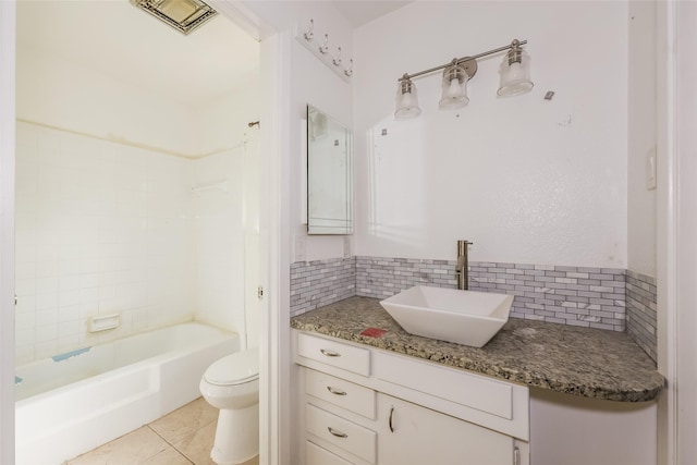 245 Straw Rd, Saginaw, TX 76179 - bathroom featuring toilet, tasteful backsplash, vanity, tile patterned floors, and shower / bathtub combination