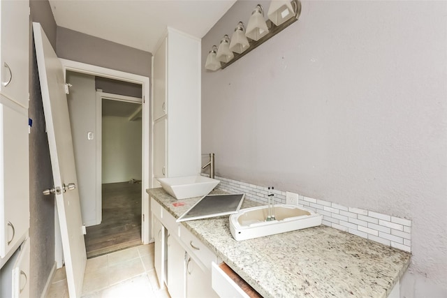 245 Straw Rd, Saginaw, TX 76179 - bathroom featuring decorative backsplash, double vanity, and tile patterned floors