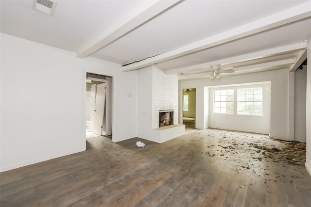 245 Straw Rd, Saginaw, TX 76179 - unfurnished living room with beam ceiling, ceiling fan, wood finished floors, and a fireplace