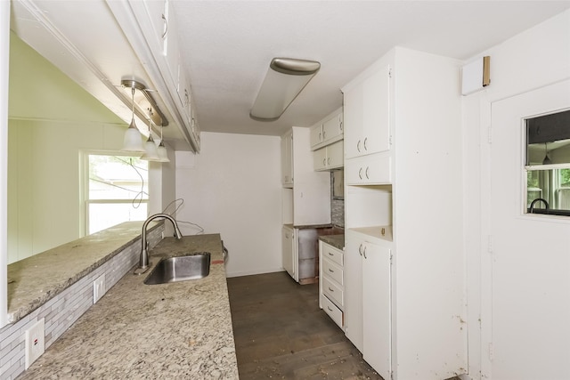 245 Straw Rd, Saginaw, TX 76179 - kitchen featuring a sink, white cabinets, and light stone counters