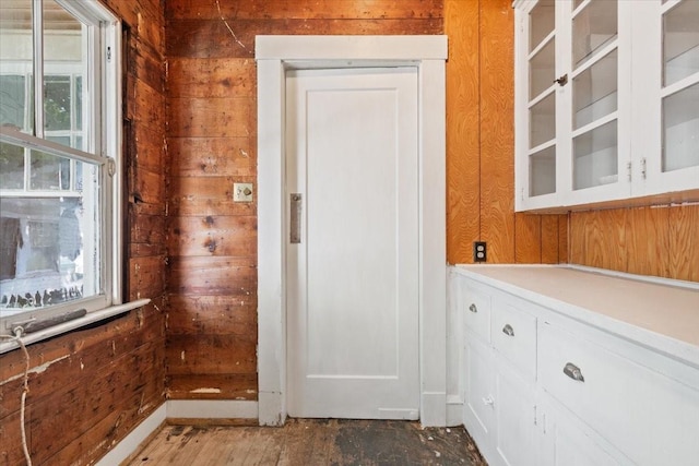 2600 Colcord Ave, Waco, TX 76707 - interior space featuring wood walls and plenty of natural light