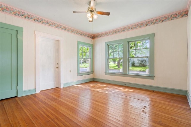 2600 Colcord Ave, Waco, TX 76707 - unfurnished room featuring wood-type flooring, a ceiling fan, and baseboards