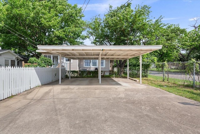 2600 Colcord Ave, Waco, TX 76707 - view of parking / parking lot featuring driveway and a detached carport