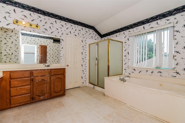 4005 Cavalier Dr, Rowlett, TX 75088 - bathroom with lofted ceiling, wallpapered walls, a stall shower, a bath, and vanity