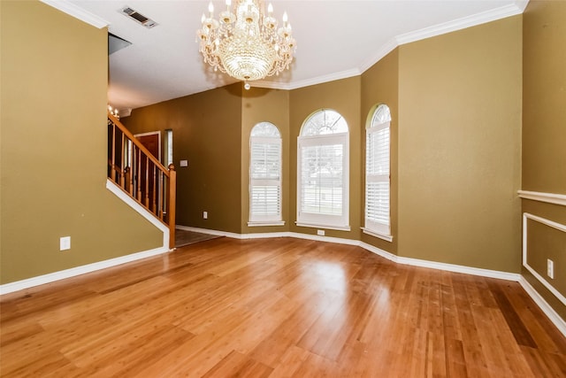 4005 Cavalier Dr, Rowlett, TX 75088 - empty room with a chandelier, wood finished floors, baseboards, and crown molding