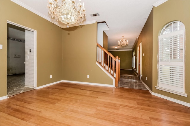 4005 Cavalier Dr, Rowlett, TX 75088 - unfurnished room featuring a chandelier, stairway, ornamental molding, wood finished floors, and baseboards