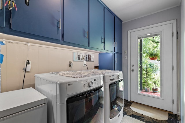 2816 Nottingham Dr, Denton, TX 76209 - laundry room with cabinet space, washing machine and clothes dryer, and crown molding