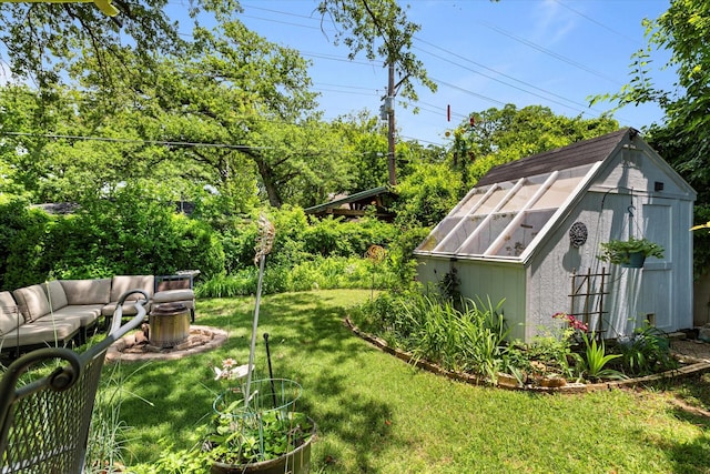2816 Nottingham Dr, Denton, TX 76209 - view of green lawn with an outdoor structure and an outdoor living space