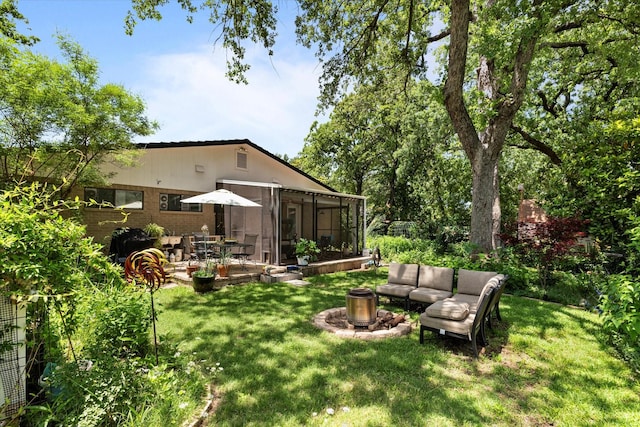 2816 Nottingham Dr, Denton, TX 76209 - view of grassy yard with outdoor lounge area, a patio area, and a sunroom