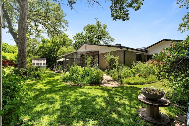 2816 Nottingham Dr, Denton, TX 76209 - view of grassy yard featuring an exterior structure