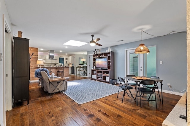 2816 Nottingham Dr, Denton, TX 76209 - living area featuring ceiling fan, dark wood finished floors, baseboards, a skylight, and recessed lighting