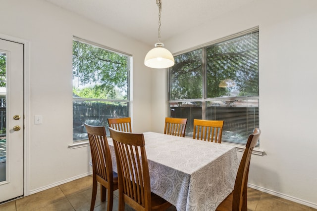 102 Pinion Dr, Euless, TX 76039 - dining space with tile patterned flooring and baseboards