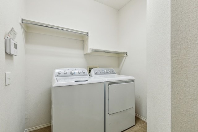 102 Pinion Dr, Euless, TX 76039 - laundry area featuring washer and dryer, light tile patterned flooring, and baseboards