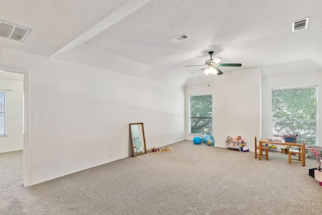102 Pinion Dr, Euless, TX 76039 - rec room with carpet floors, ceiling fan, and a textured ceiling