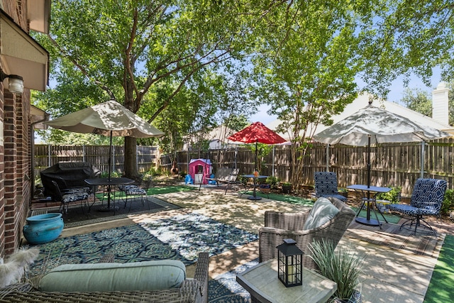 102 Pinion Dr, Euless, TX 76039 - fenced backyard with a patio and outdoor dining space