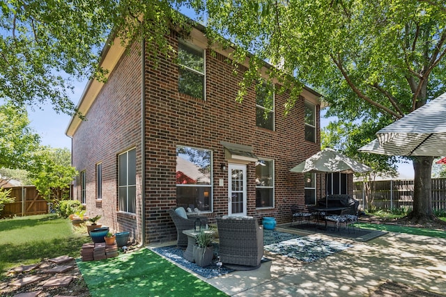 102 Pinion Dr, Euless, TX 76039 - rear view of property featuring brick siding and a patio