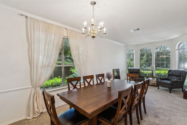 102 Pinion Dr, Euless, TX 76039 - dining space with light carpet, plenty of natural light, a chandelier, and ornamental molding