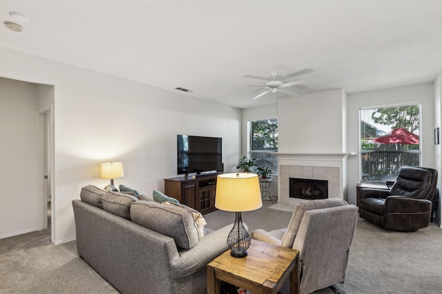 102 Pinion Dr, Euless, TX 76039 - carpeted living room featuring a fireplace, ceiling fan, and baseboards