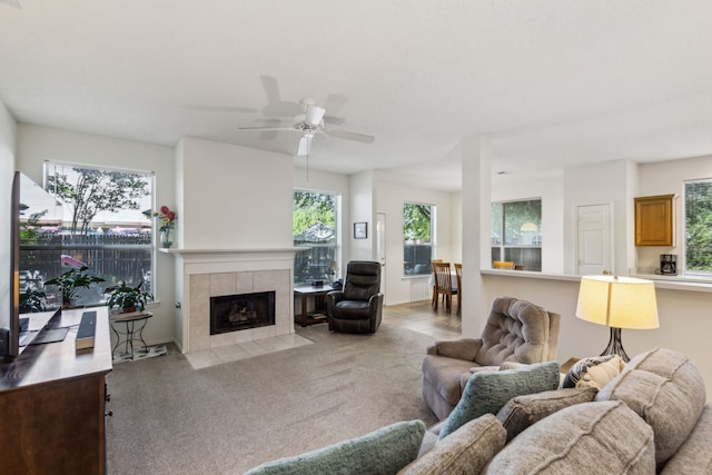 102 Pinion Dr, Euless, TX 76039 - living room featuring a fireplace, carpet flooring, and a ceiling fan
