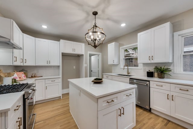 5836 Marquita Ave, Dallas, TX 75206 - kitchen featuring stainless steel appliances, a sink, recessed lighting, a chandelier, and tasteful backsplash