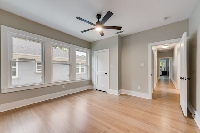 5836 Marquita Ave, Dallas, TX 75206 - unfurnished bedroom featuring attic access, light wood-type flooring, baseboards, and ceiling fan