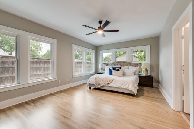 5836 Marquita Ave, Dallas, TX 75206 - bedroom with baseboards, light wood finished floors, and ceiling fan