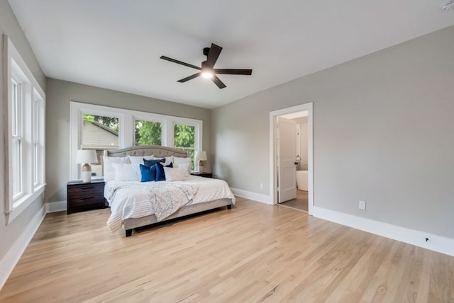 5836 Marquita Ave, Dallas, TX 75206 - bedroom featuring baseboards, light wood-style flooring, a ceiling fan, and ensuite bath