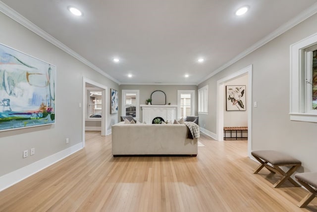5836 Marquita Ave, Dallas, TX 75206 - living area featuring light wood-style floors, recessed lighting, baseboards, a brick fireplace, and ornamental molding