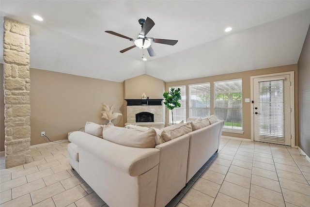 12315 Red Hawk Dr, Frisco, TX 75033 - living area featuring lofted ceiling, a fireplace, ceiling fan, light tile patterned floors, and baseboards