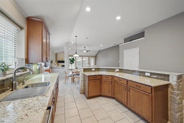 12315 Red Hawk Dr, Frisco, TX 75033 - kitchen with ceiling fan, a sink, lofted ceiling, light tile patterned floors, and open floor plan
