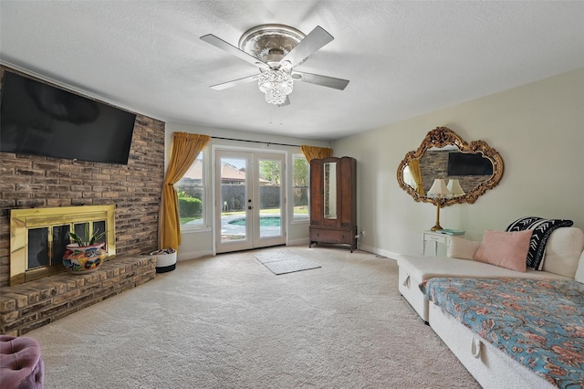 3407 Dovecreek Dr, Arlington, TX 76016 - living room featuring carpet flooring, ceiling fan, french doors, a textured ceiling, and baseboards