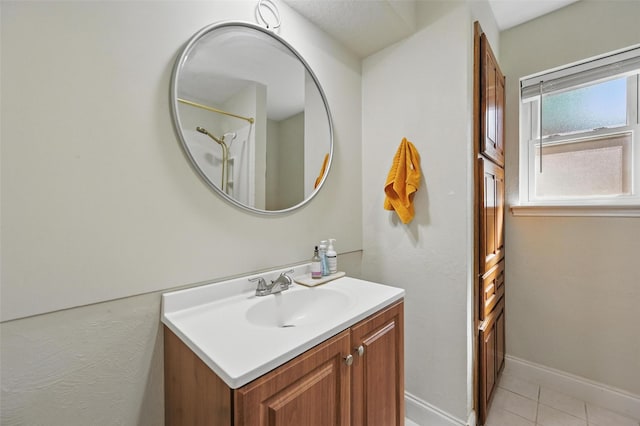 3407 Dovecreek Dr, Arlington, TX 76016 - bathroom with vanity, tile patterned flooring, and baseboards