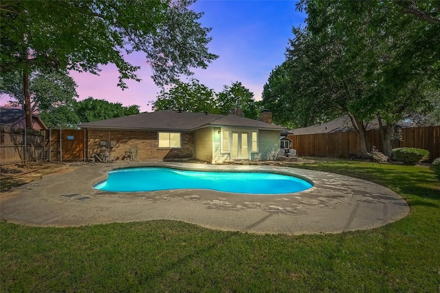 3407 Dovecreek Dr, Arlington, TX 76016 - pool at dusk with french doors and a patio area