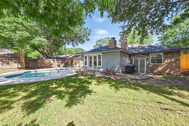 3407 Dovecreek Dr, Arlington, TX 76016 - rear view of property featuring french doors, a chimney, and a patio area