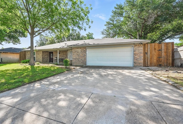 3407 Dovecreek Dr, Arlington, TX 76016 - view of front of house featuring driveway, brick siding, and a garage