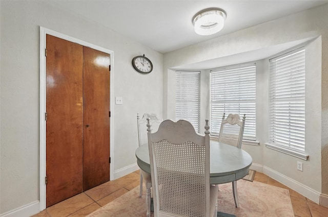 3407 Dovecreek Dr, Arlington, TX 76016 - dining space featuring light tile patterned floors and baseboards