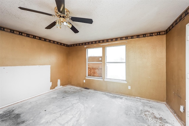 7922 Jubilant Dr, Dallas, TX 75237 - unfurnished room with concrete floors, ceiling fan, and a textured ceiling