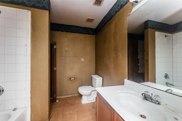 7922 Jubilant Dr, Dallas, TX 75237 - full bathroom featuring vanity, toilet, tub / shower combination, a textured ceiling, and tile patterned floors