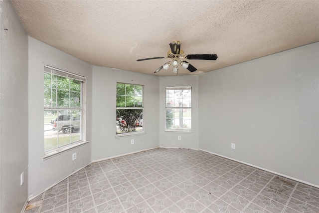 7922 Jubilant Dr, Dallas, TX 75237 - unfurnished room with ceiling fan, plenty of natural light, a textured ceiling, and baseboards
