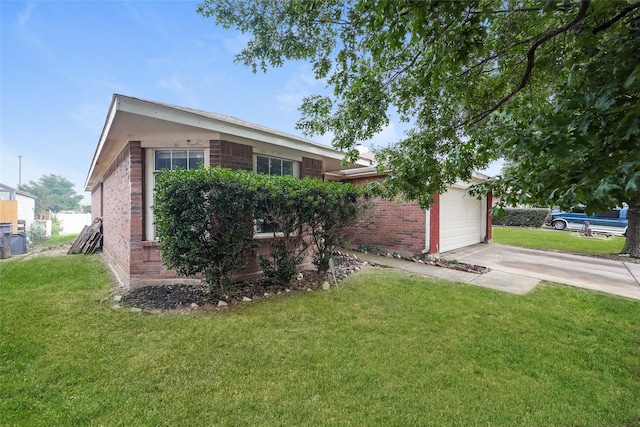 7922 Jubilant Dr, Dallas, TX 75237 - view of side of home featuring brick siding, a garage, concrete driveway, and a lawn
