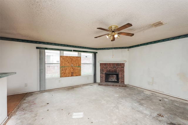 7922 Jubilant Dr, Dallas, TX 75237 - unfurnished living room with a ceiling fan, a brick fireplace, a textured ceiling, and concrete flooring