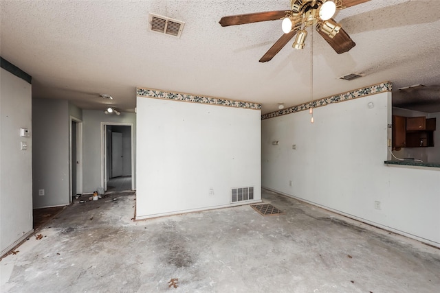 7922 Jubilant Dr, Dallas, TX 75237 - unfurnished room with a ceiling fan, a textured ceiling, and concrete floors