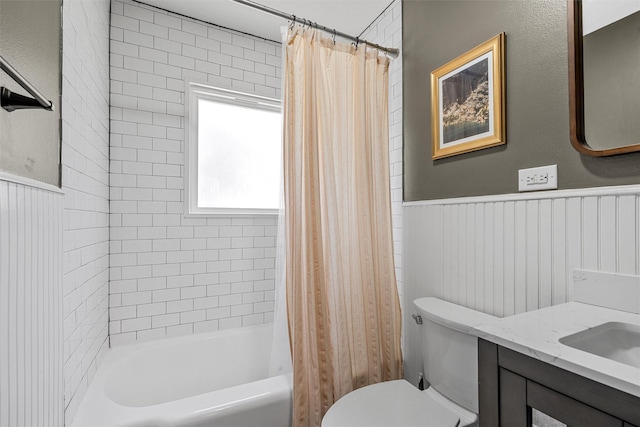 211 N 40th St, Waco, TX 76710 - bathroom with toilet, shower / bath combination with curtain, wainscoting, and vanity