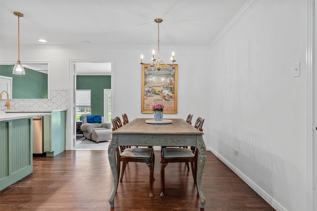 211 N 40th St, Waco, TX 76710 - dining room featuring a chandelier, dark wood-type flooring, ornamental molding, recessed lighting, and baseboards